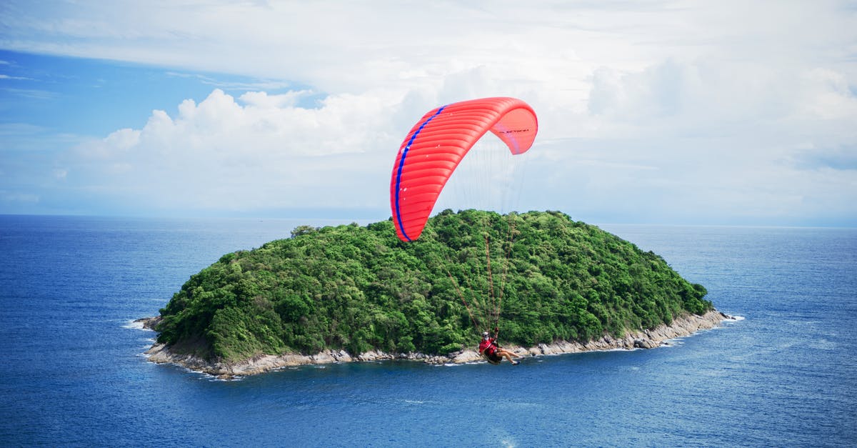 Dive shop availability and cost in Phuket and Koh Tao, Thailand - Person Riding Parachute