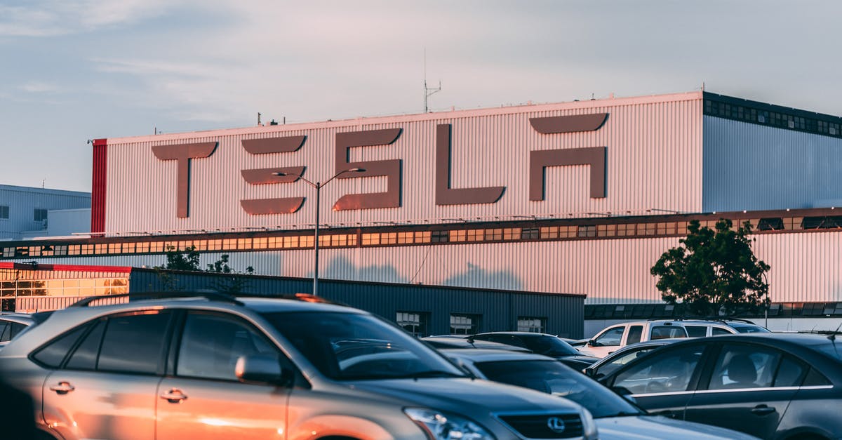 Do car rental companies have franchise system? - Cars Parked In Front Of Company Building