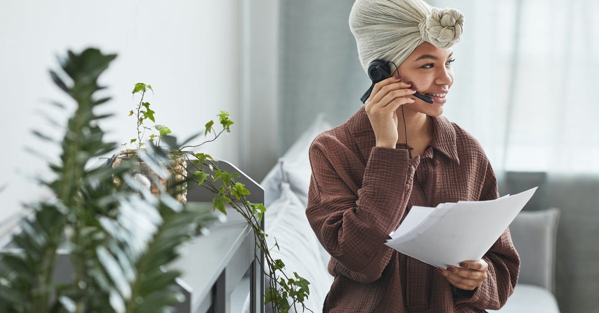 Do Chinese customs agents check the contents of Kindles and notebooks? - Positive black woman with handsfree headset and documents