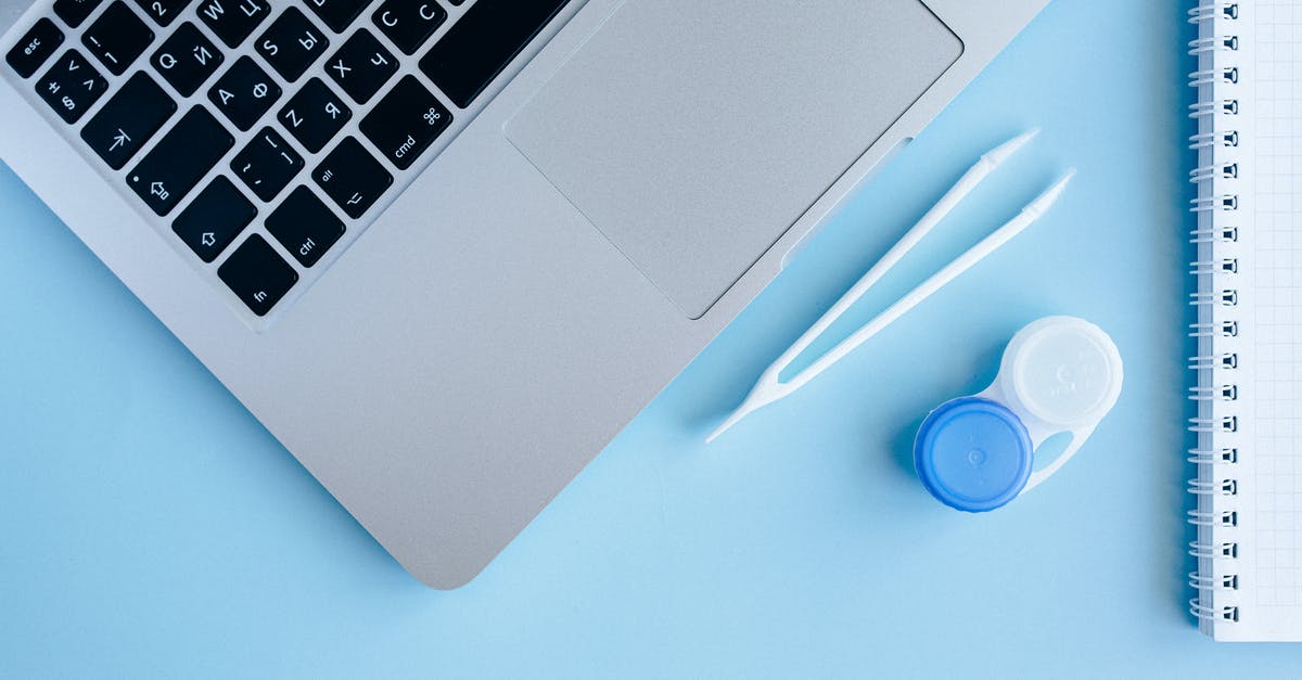 Do disposable contact lenses need to be declared as "liquids"? - Macbook Pro Beside Blue and White Ceramic Mug