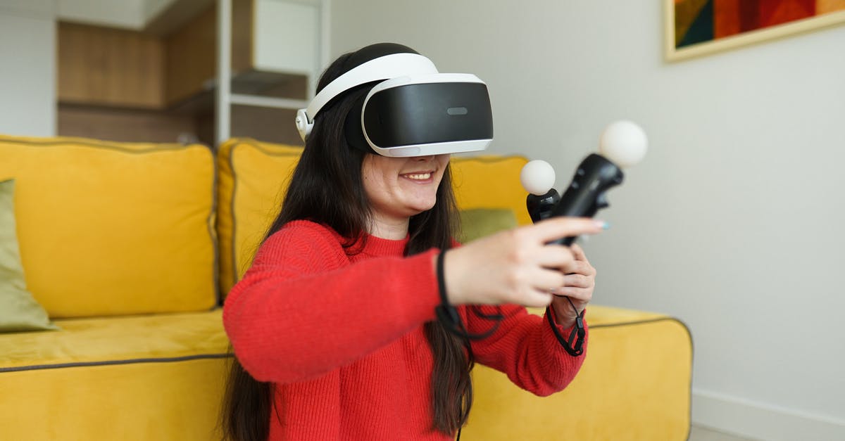 Do electronics bought airside have to be fully charged? - A Woman Playing Virtual Reality