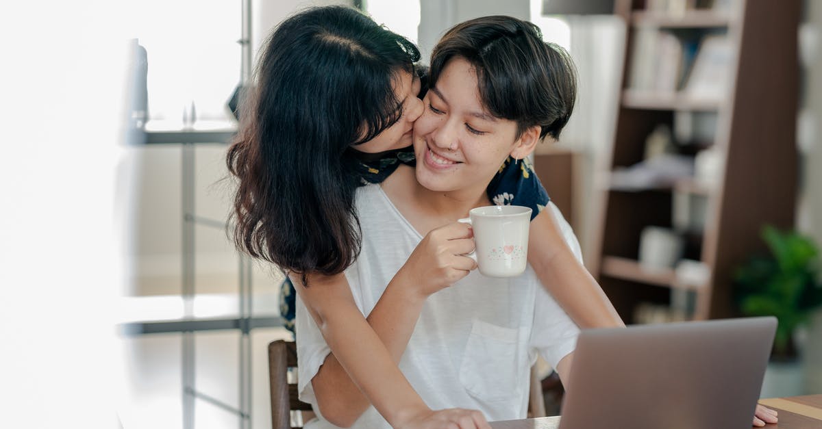 Do electronics bought airside have to be fully charged? - Photo of Couple Smiling