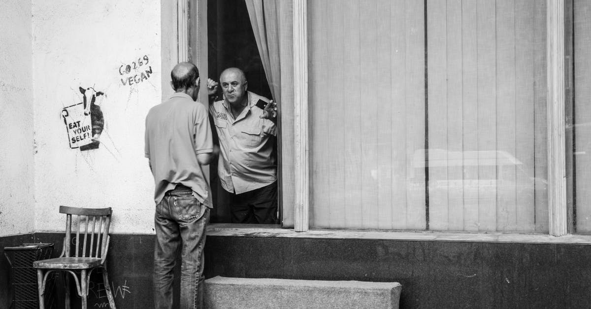 Do French immigration police at St. Pancras for Eurostar speak English? - Black and white adult man standing outside shabby building and talking with policeman through window Do French immigration police at St. Pancras for Eurostar speak English? - Black and white adult man standing outside shabby building and talking with policeman through window