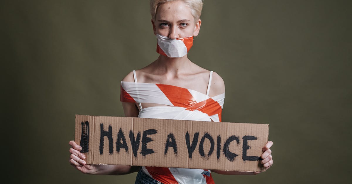 Do I have to collect my bags if I have multiple layovers? - A Woman Holding a Placard