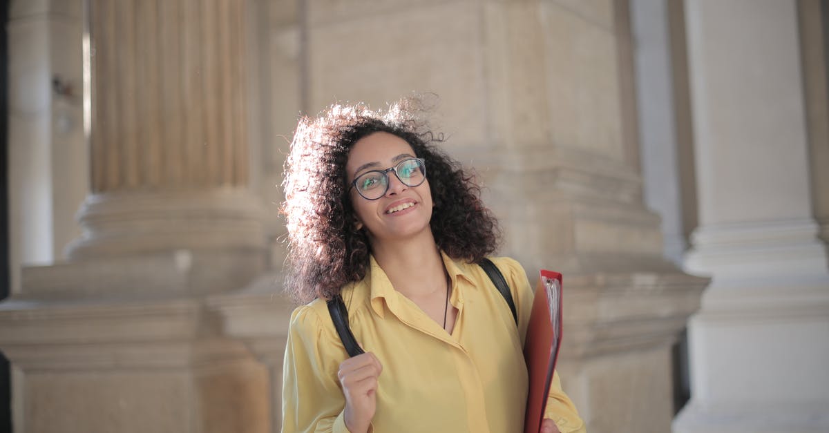 Do I need a Dominican Republic tourist visa as an F1 student from Saudi Arabia? - Cheerful young clever student with papers and backpack on campus