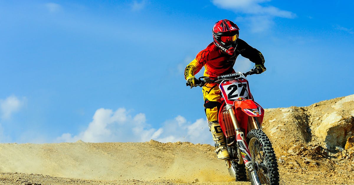 Do I need a motorcycle licence to ride a motorcycle in Bolivia? - Person Driving Motocross Dirt Bike Under Blue Sky
