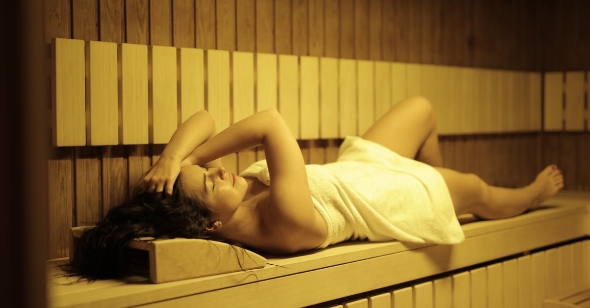 Do I need a towel in saunas in Germany? - Woman in Sauna