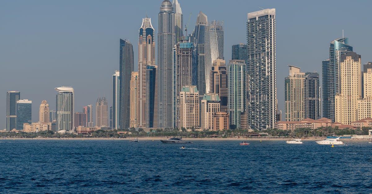 Do I need a transit visa for a layover in the United Arab Emirates? - Aerial View of City Lit Up at Night Do I need a transit visa for a layover in the United Arab Emirates? - Aerial View of City Lit Up at Night