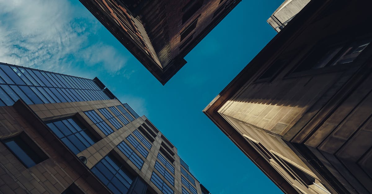 Do I need a transit visa for Manchester UK [duplicate] - Low-Angle Shot of Concrete Buildings