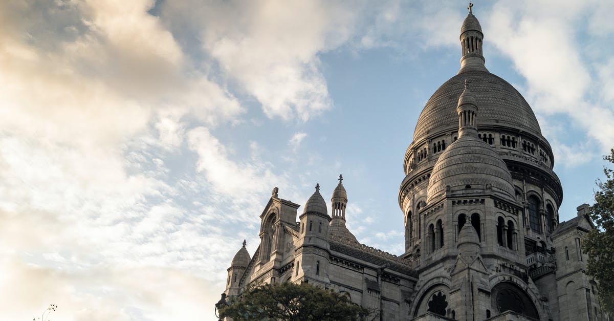 Do I need a transit visa in Paris and Panama? - Brown Concrete Building Under Blue Sky