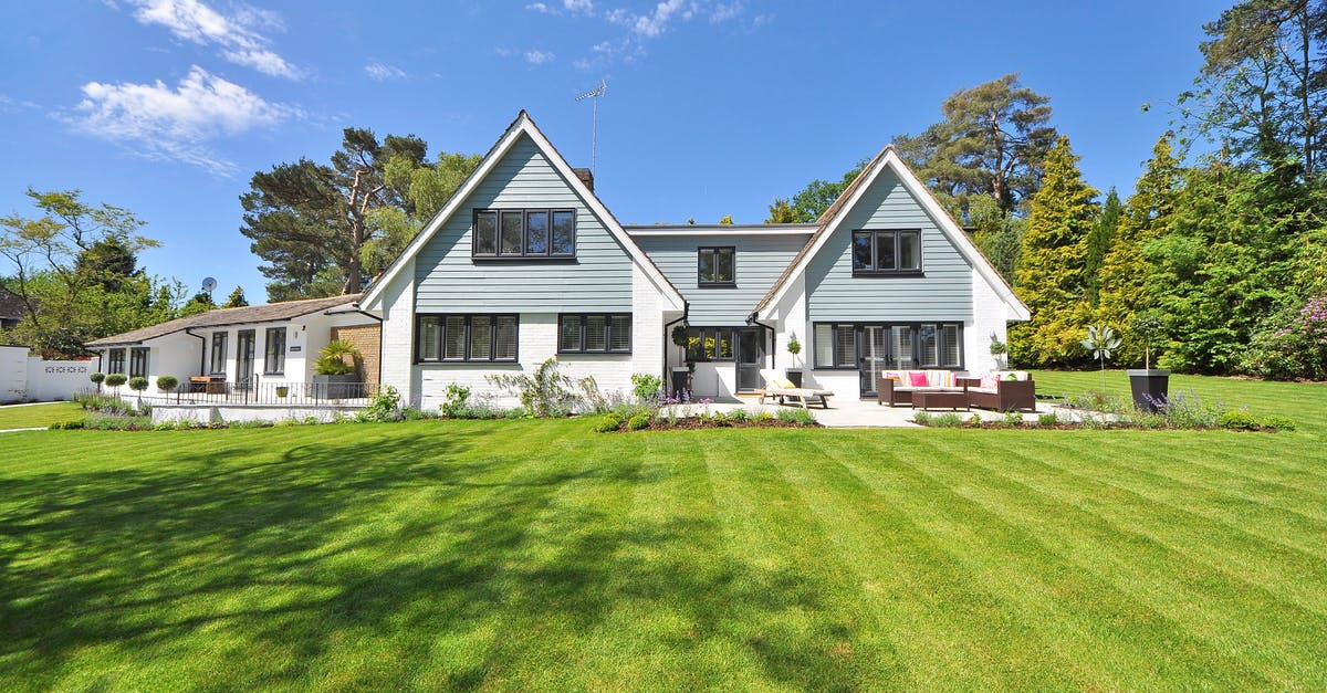 Do I need a UK visa with a Slovenian residence card? - White and Gray Wooden House Near Grass Field and Trees