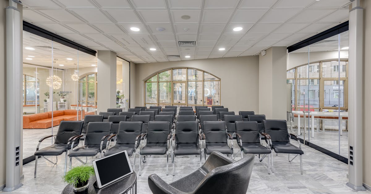 Do I need a visa to organise and run a conference in the UK? - Black and Gray Chairs Inside Room