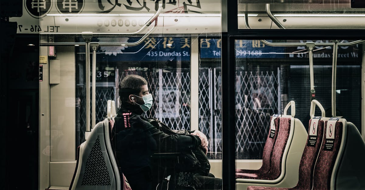 Do I need a visa to transit through Germany? - Unrecognizable passenger in bus during COVID 19 pandemic