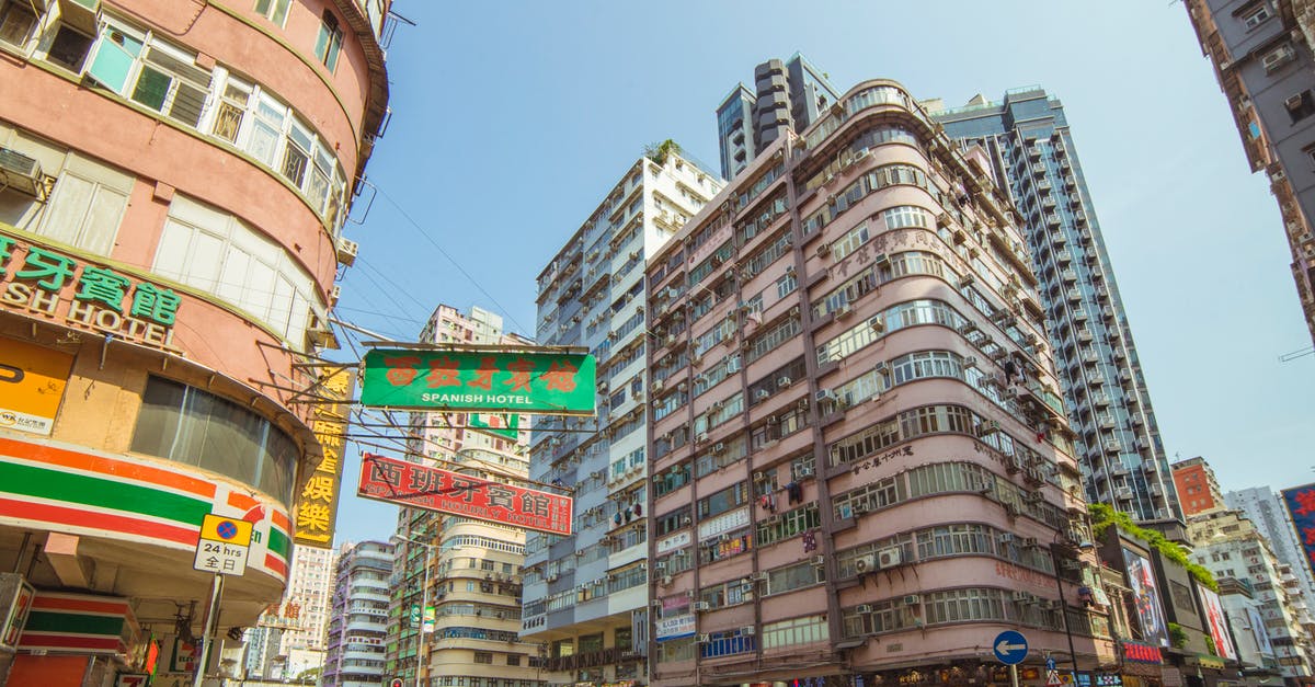 Do I need an old passport to get chinese visa in Hong Kong? - Group of People Near Road and Buildings