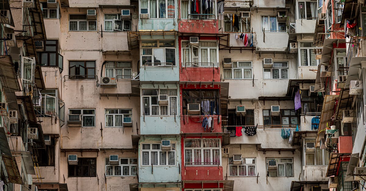 Do I need an old passport to get chinese visa in Hong Kong? - Low Angle Shot Of An Old Apartment Building Exterior With Worn Out Paint