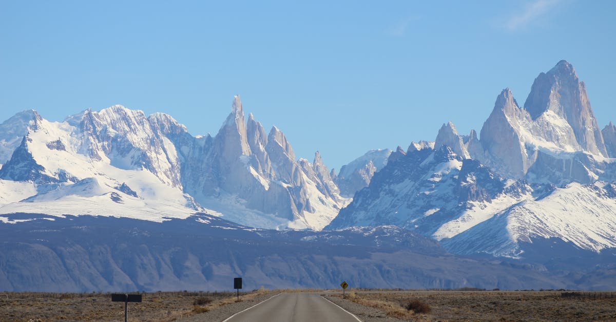 Do I need to get USD to travel in Argentina? - Snow Covered Mountains Under the Blue Sky