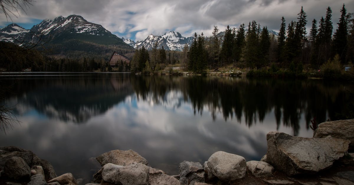 Do I need to make a reservation in a mountain hut in Slovakia in the Tatra mountains? - Body of Water Surrounded by Trees