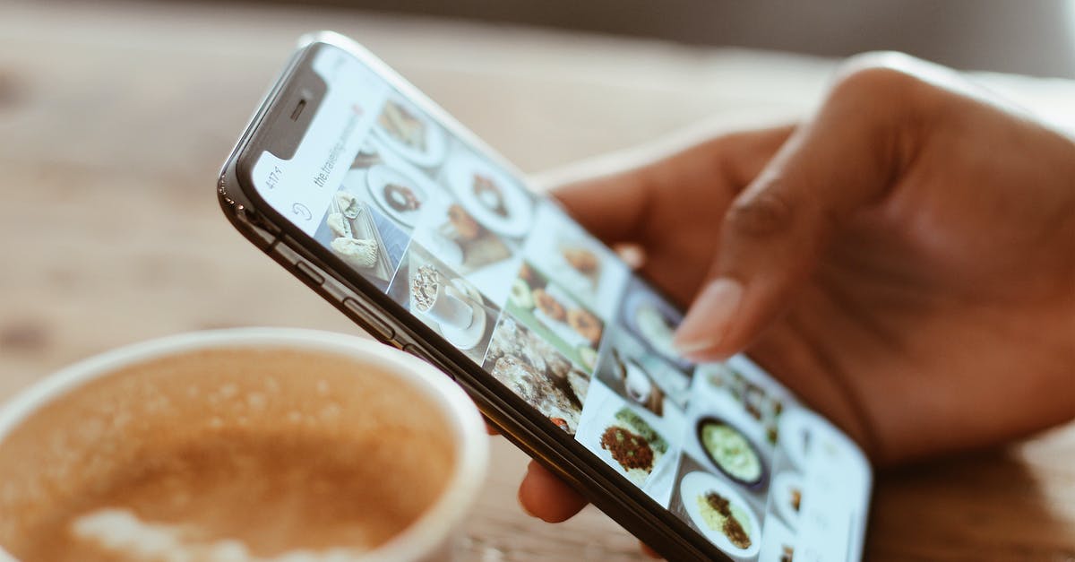 Do I need to pick up luggage for transit? - Selective Focus Photography of Person Using Iphone X