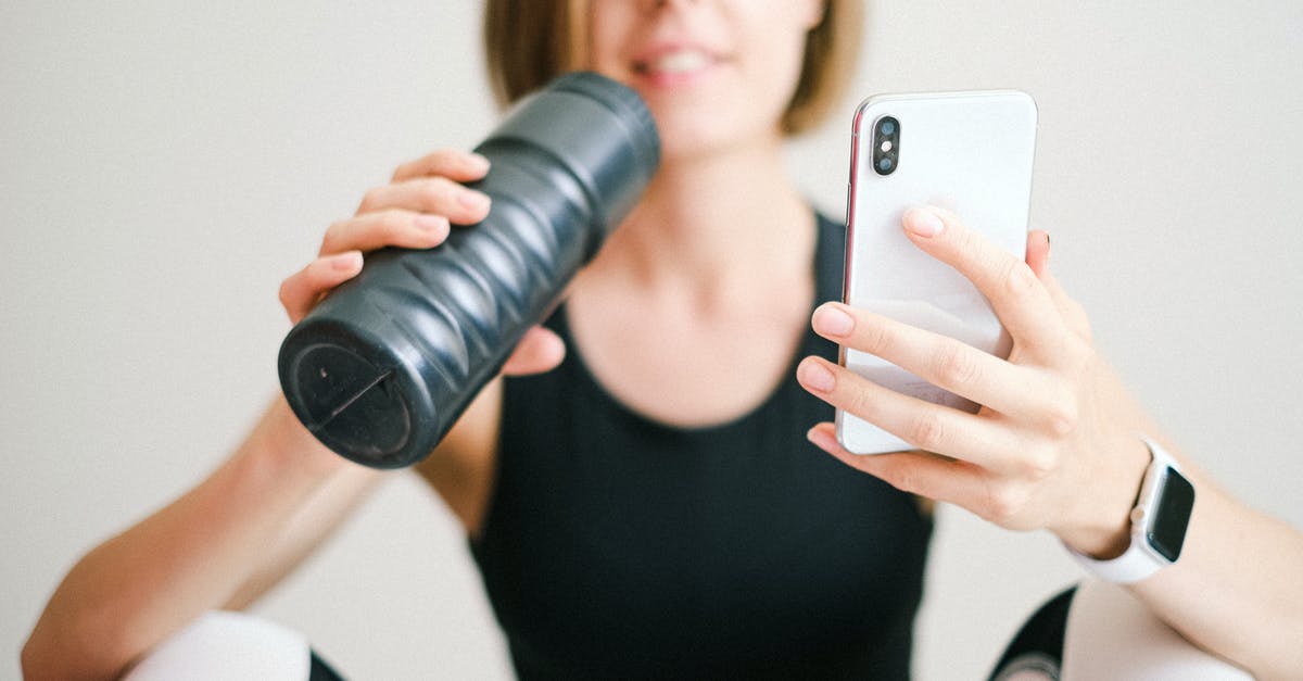 Do I need to validate train tickets that were purchased online? - Photo of Woman Holding White Smartphone and Sports Bottle