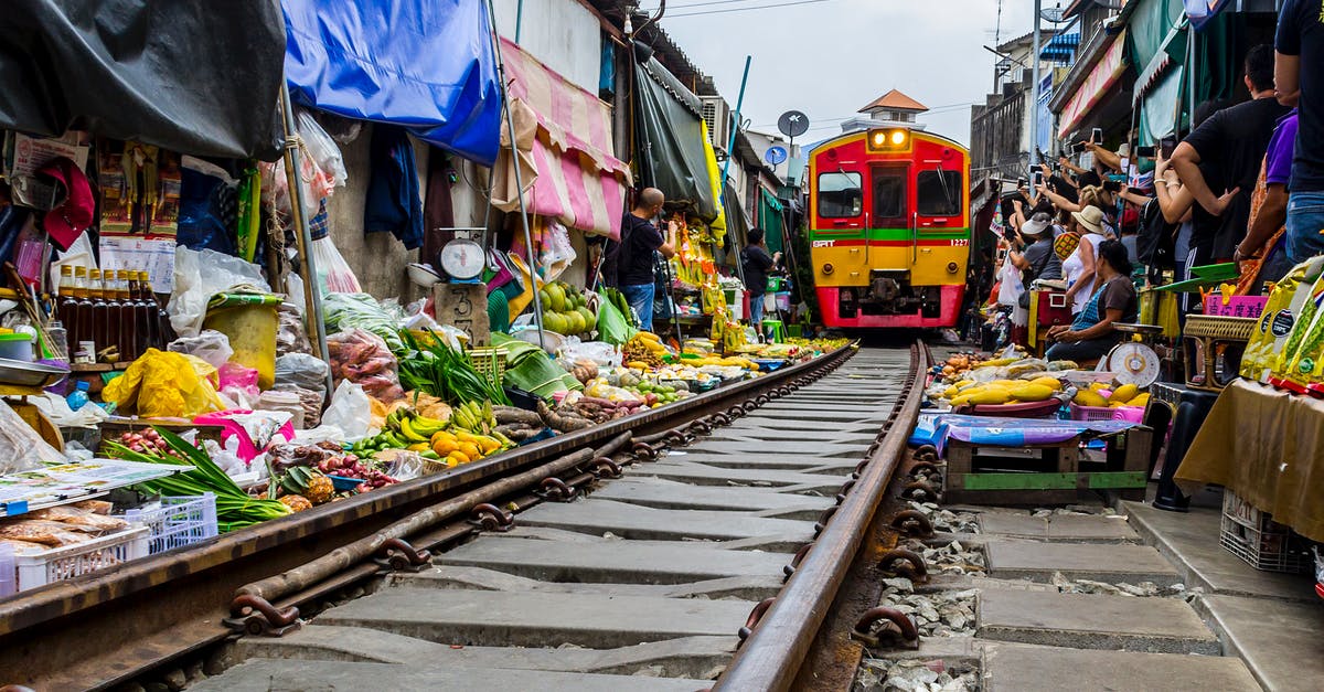 Do I need transit visa for my Bangkok layovers? - Mae Klong train market in Samut Songkhram, Thailand