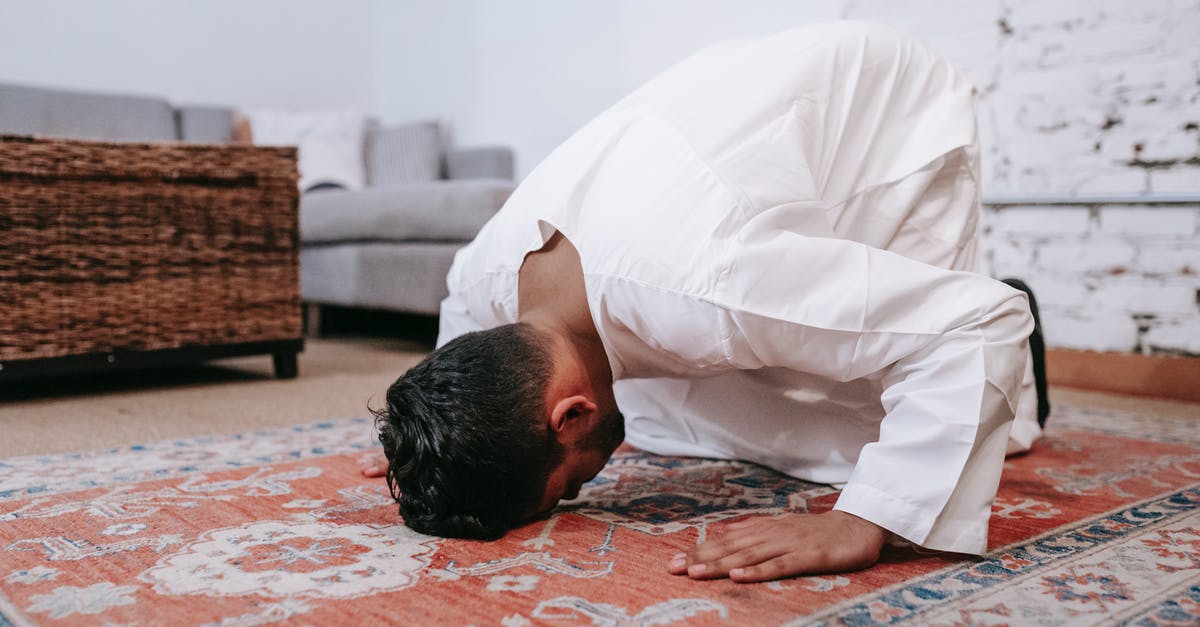 Do i require a transit visa to head through munich? [duplicate] - Man in White Thobe Bowing Down on Red and Blue Rug