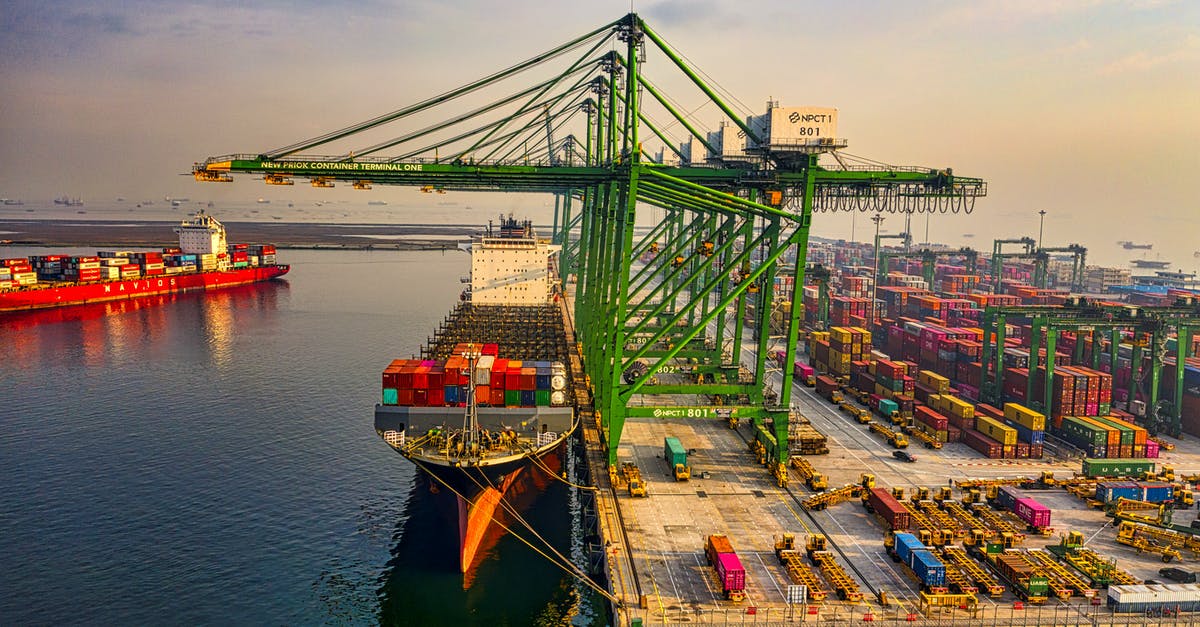 Do passengers and crew on cargo ships require visas? - Drone Shot of a Docked Cargo Ship at a Port