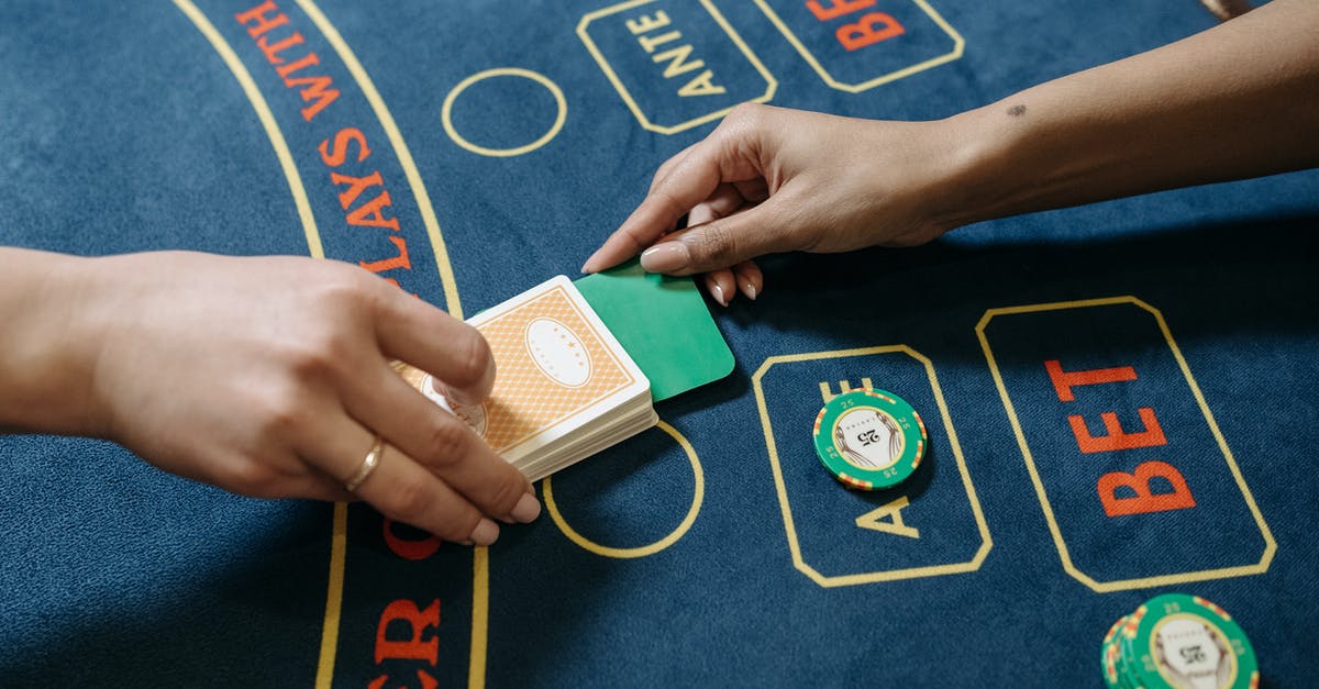 Do PINs added to chip-and-sign cards work at chip-and-PIN terminals? - A Player Cutting the Playing Cards with Plastic Strip