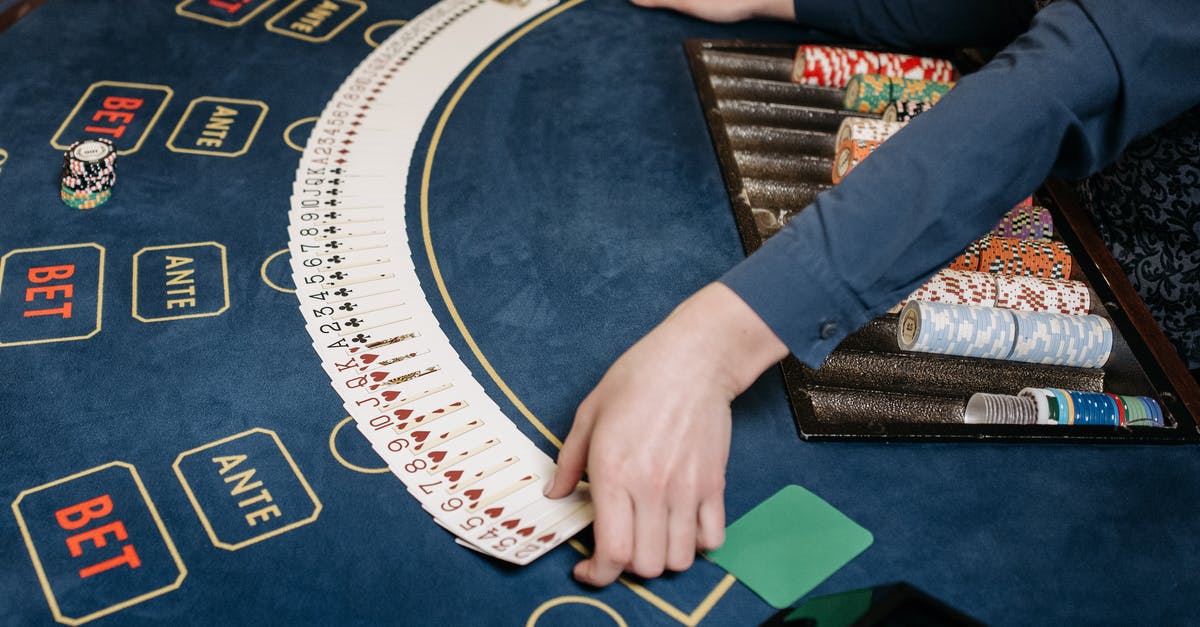 Do PINs added to chip-and-sign cards work at chip-and-PIN terminals? - A Dealer Spreading the Playing Cards