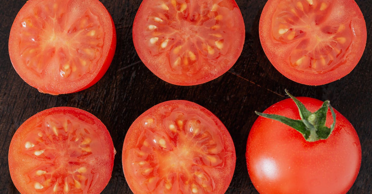 Do seasonal flights from Trondheim to Edinburgh, London, or any other part of the UK exist? - Top view closeup of fresh halves of ripe tomatoes with juice on cut side and whole tomato placed on wooden cutting board Do seasonal flights from Trondheim to Edinburgh, London, or any other part of the UK exist? - Top view closeup of fresh halves of ripe tomatoes with juice on cut side and whole tomato placed on wooden cutting board