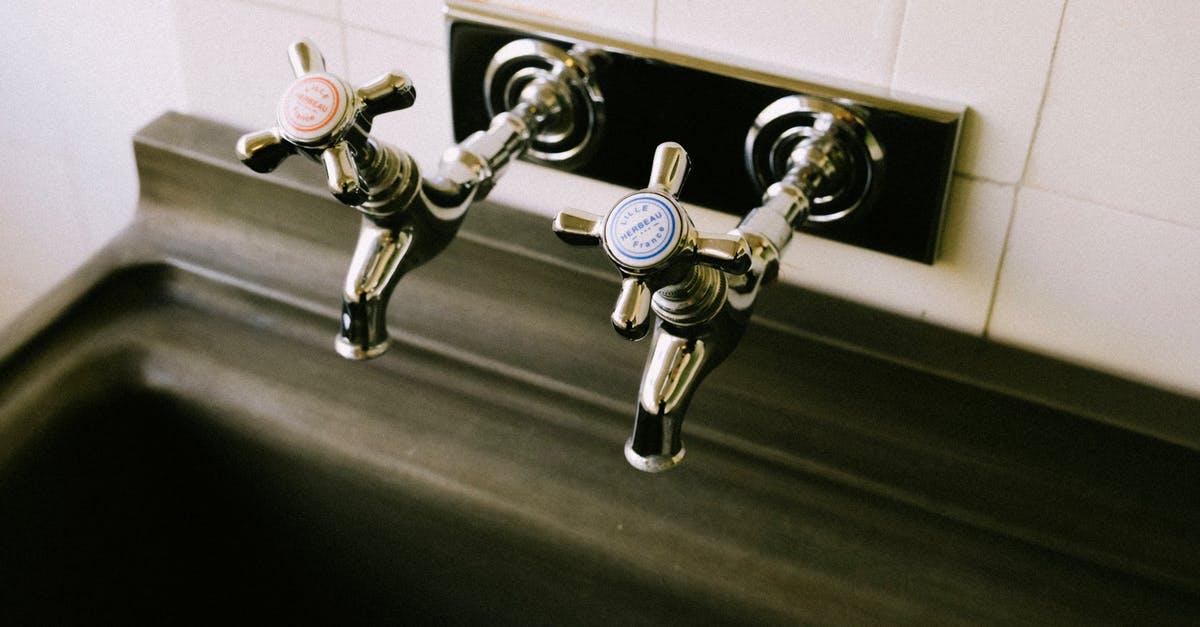 Do ships sink nowadays? [closed] - Close-Up Shot of Two Silver Faucets in the Sink