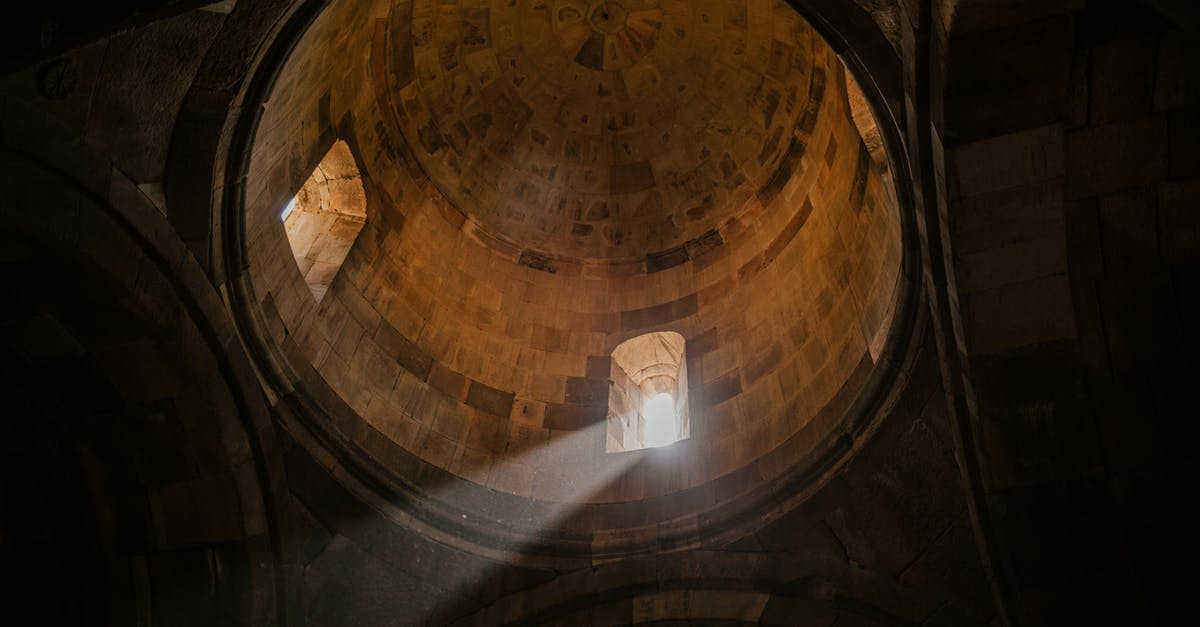 Do Trenitalia operate trains from Pré Saint Didier to Ivrea? - From below of bright sunshine illuminating through window of dome in ancient stone cathedral