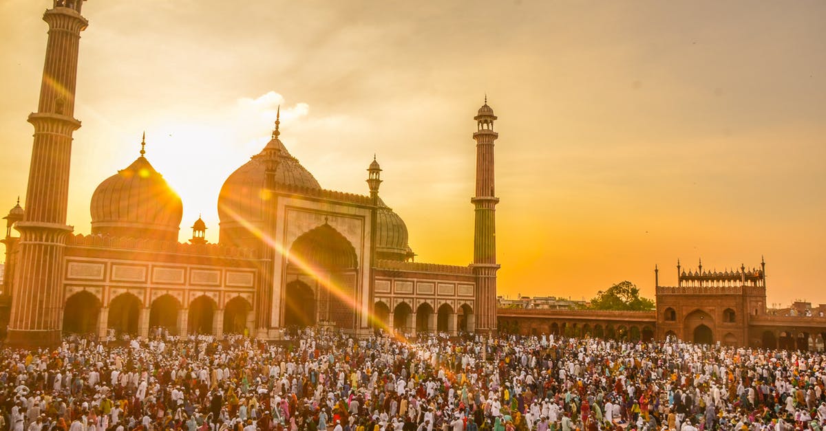 Do we stay airside at Delhi T3? - Photo Of People In Front Of Mosque During Golden Hour