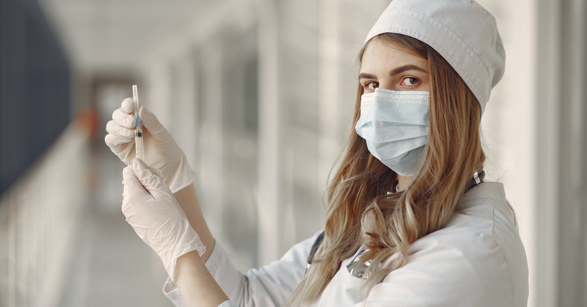 Do you get any protection from an incomplete vaccine series? [closed] - Woman Holding an Injection