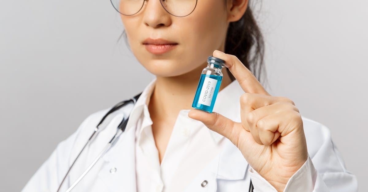 Do you get any protection from an incomplete vaccine series? [closed] - Close-Up Shot of a Woman Holding a Covid-19 Vaccine