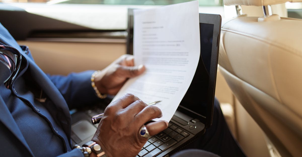 Documents for travelling within the Schengen region - Person in Blue Long Sleeve Shirt Using Black Laptop Computer