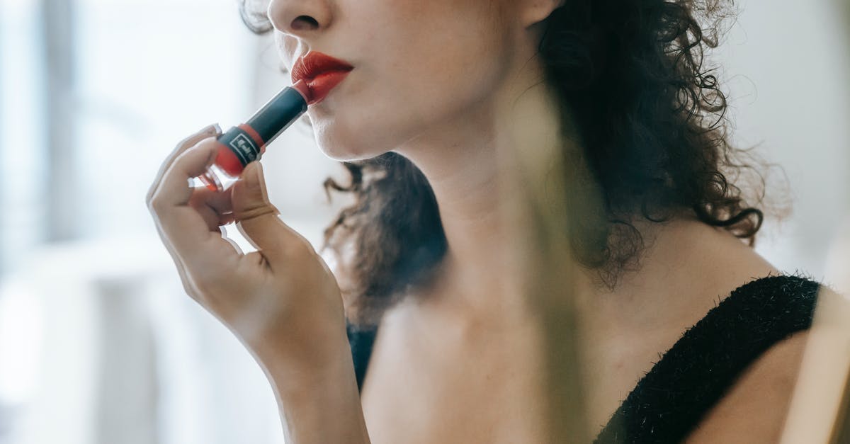 Does 24-hour grace period apply after paid changes to airline reservations? - Content young woman applying red lipstick on lips