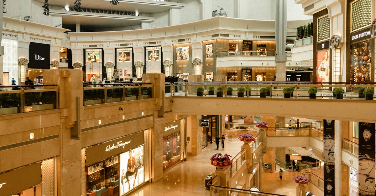 Does a moped need a Carnet de Passage for Iran? - Contemporary design of big mall interior with ribbed column and decorative elements on ceiling with glowing corridors illuminated by artificial lights and signboards with inscriptions