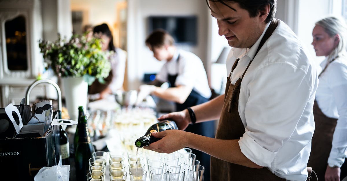 Does a third-party booking service know you've missed a flight? - Man Pouring Wine on Glasses