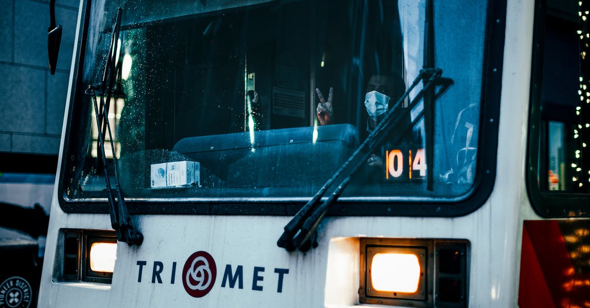 Does any train or bus company charge a no-show fee, or is that fee specific to some airlines? [closed] - Through windshield glass of unrecognizable male driver of public transport in medical mask looking at camera and showing two fingers gesture