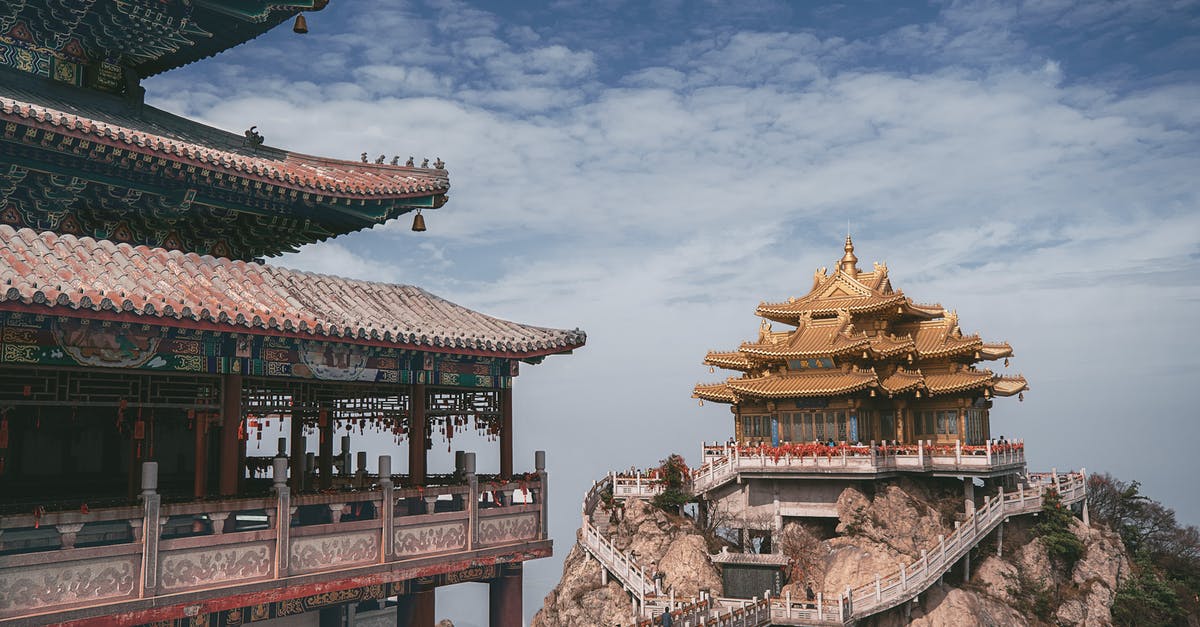 Does anyone recognize this temple in SE Asia? - Brown and Green Pagoda Temple Under Cloudy Sky