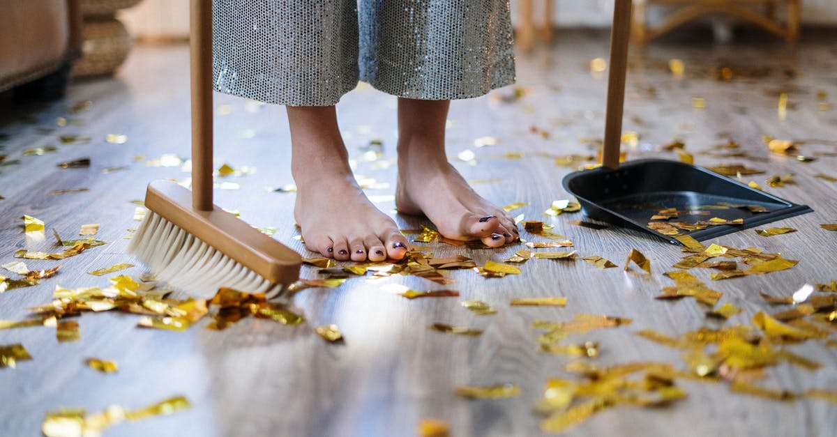 Does declining housekeeping deny housekeepers of their income? - Woman in Gray Dress Standing on Brown Wooden Floor