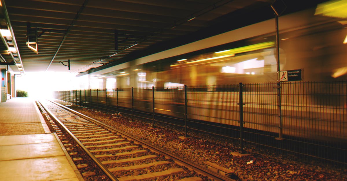 Does DFW have moving walkways in any terminal? - Timelapse Photography of Railroad