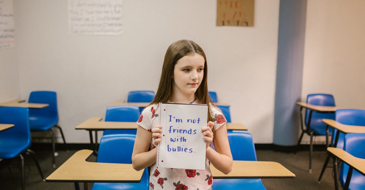 Does easyJet allow a "personal item"? - Girl Showing a Message Against Bullying Written in a Notebook