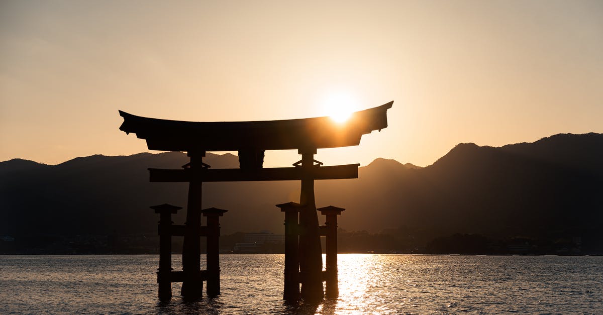 Does Japan Airlines have an unconditional 24-hour refund policy? - 
A Silhouette of the Itsukushima Shrine in Japan