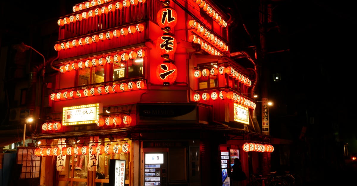 Does Japan have pubs or bars? - Red and White Concrete Building during Nighttime