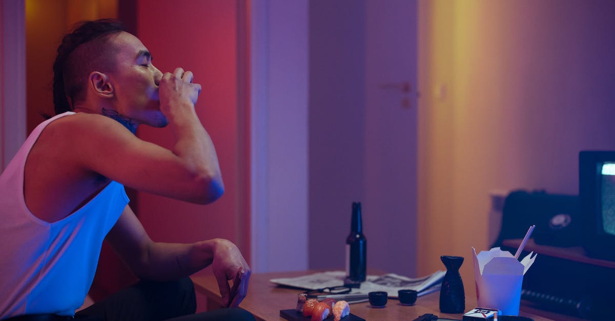 Does knowing Japanese help in neighbouring countries? - Man in Blue Tank Top Sitting on Black Chair