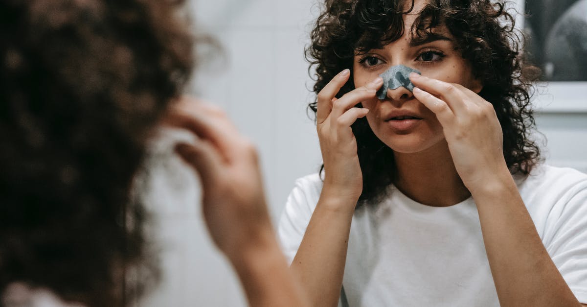 Does Nexus renewal grace period apply to enter Canada? - Calm woman applying skincare product on face