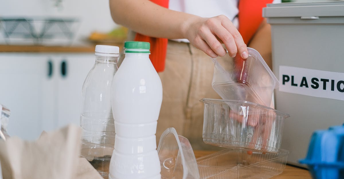 Does Romania put visa refusal stamps? - Woman sorting out plastic wastes at home