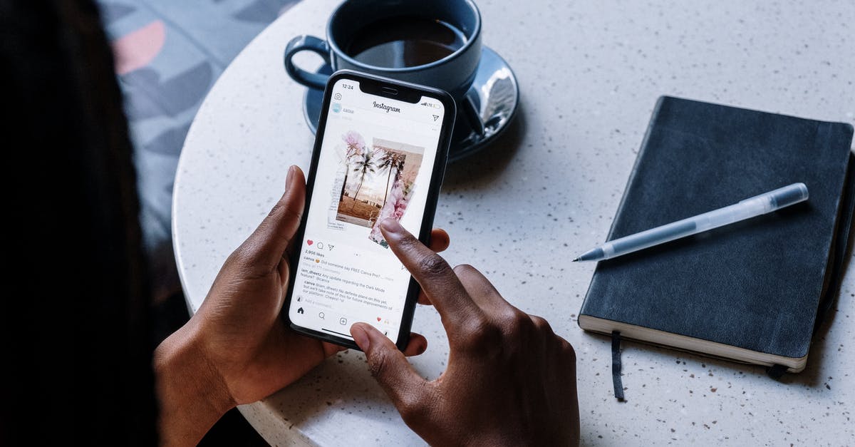 Does Singapore have an electronics district something like Tokyo's Akihabara? - Person Holding White Printer Paper Near Black Ceramic Mug With Coffee