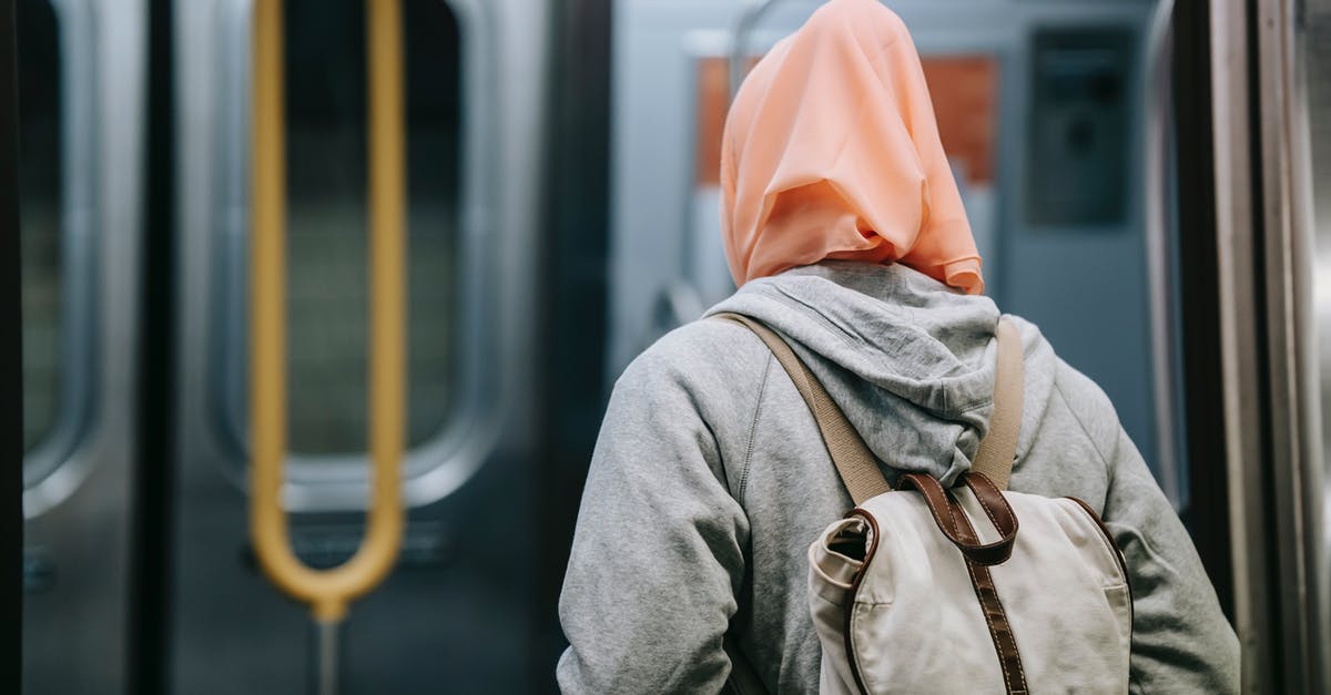 Does the PATH train keep to schedule? - Woman with backpack in subway